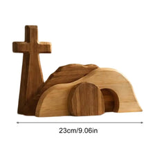 Wooden Easter empty tomb scene decoration featuring a cross and a sculpted tomb structure.