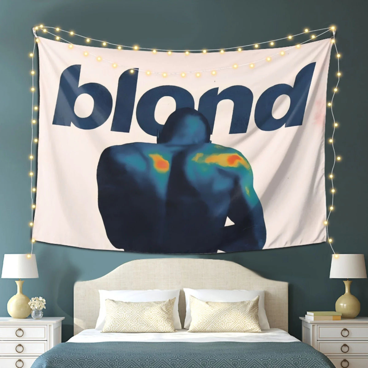 A tapestry featuring a silhouette of a person against a light background, illuminated by string lights.