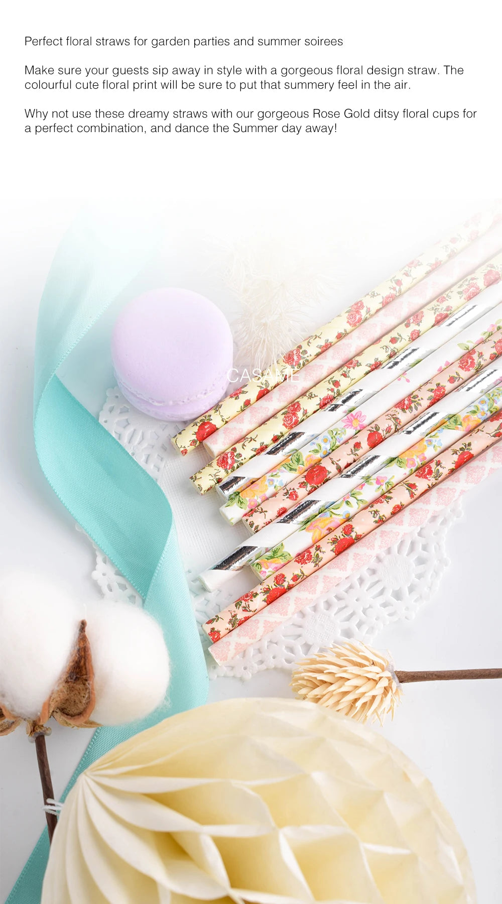 A collection of colorful striped and polka dot paper drinking straws with floral accents and a pale yellow flower