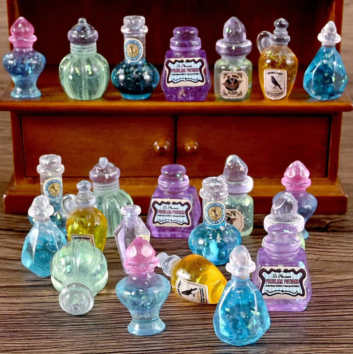 A collection of miniature resin magic potion bottles in various colors and shapes for dollhouse decor.