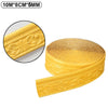 Yellow self-adhesive wall trim border featuring an ornate scroll pattern rolled into a strip