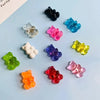 A collection of ten bear-shaped magnetic chalkboard and message stickers in various colors including black, blue, pink, purpl