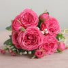 A bouquet of vibrant pink silk rose and peony artificial flowers arranged for home or event decor.