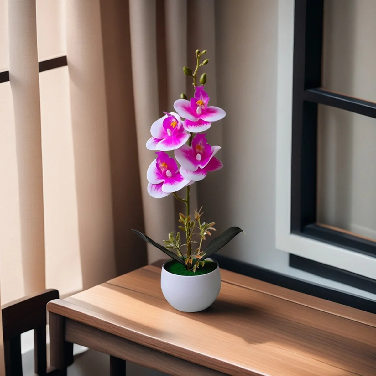 A realistic artificial orchid potted plant with pink and purple flowers sits on a wooden table.