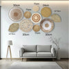 A gallery wall featuring various round straw and woven natural fiber wall hangings in beige and tan tones.