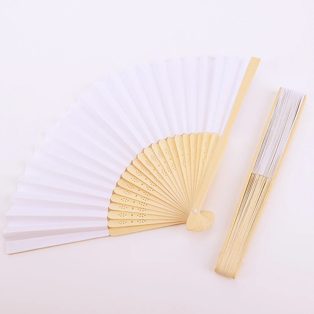 A light wood bamboo folding fan with white paper blades shown open and closed.