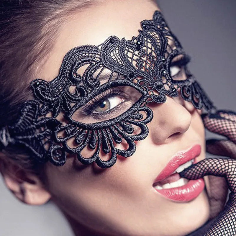 Close-up of a woman wearing a black lace floral eye mask for a masquerade or cosplay.