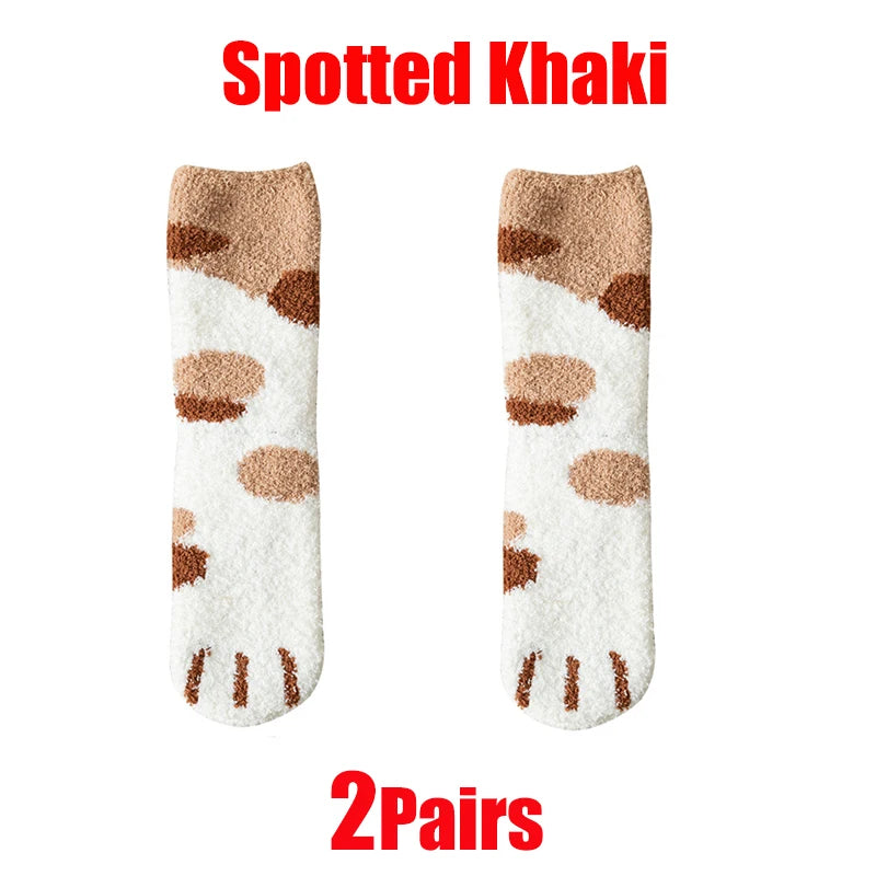 A pair of speckled khaki plush socks featuring brown cat paw prints on a white background.