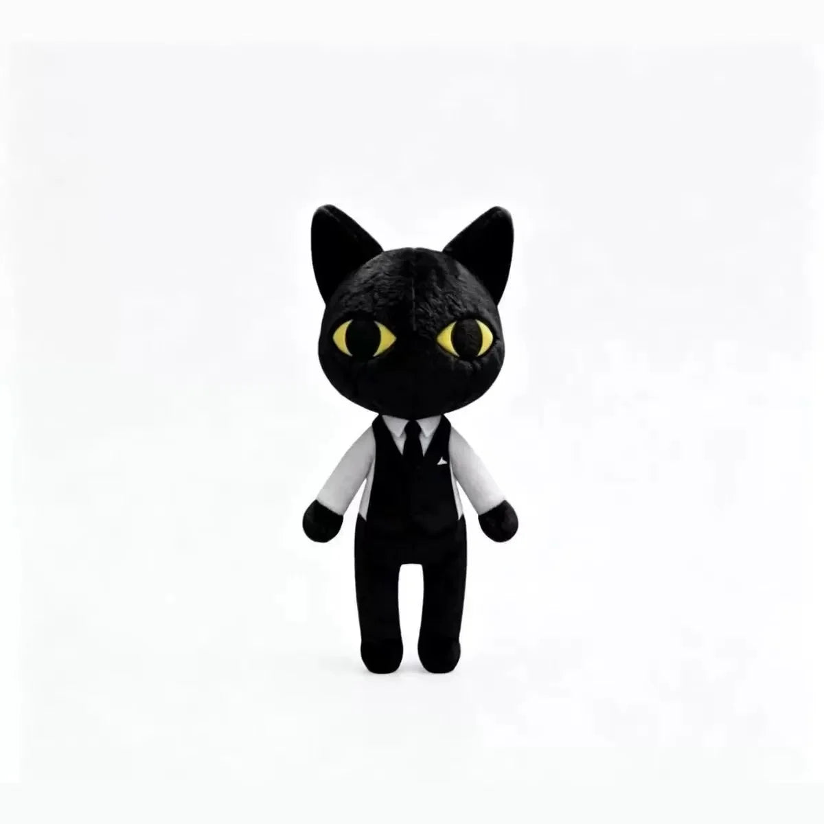A black plush toy of a cat with yellow eyes against a white background.