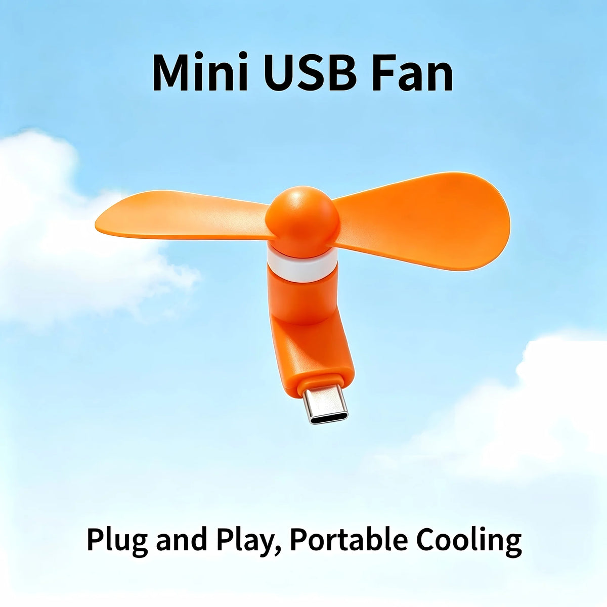 An orange mini USB fan with soft blades is shown against a light blue sky background.