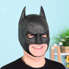 A person is wearing a realistic black cat mask for a Halloween costume.