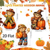 A set of three painted wooden animal figures, including a scarecrow and pumpkins, for autumn decor.