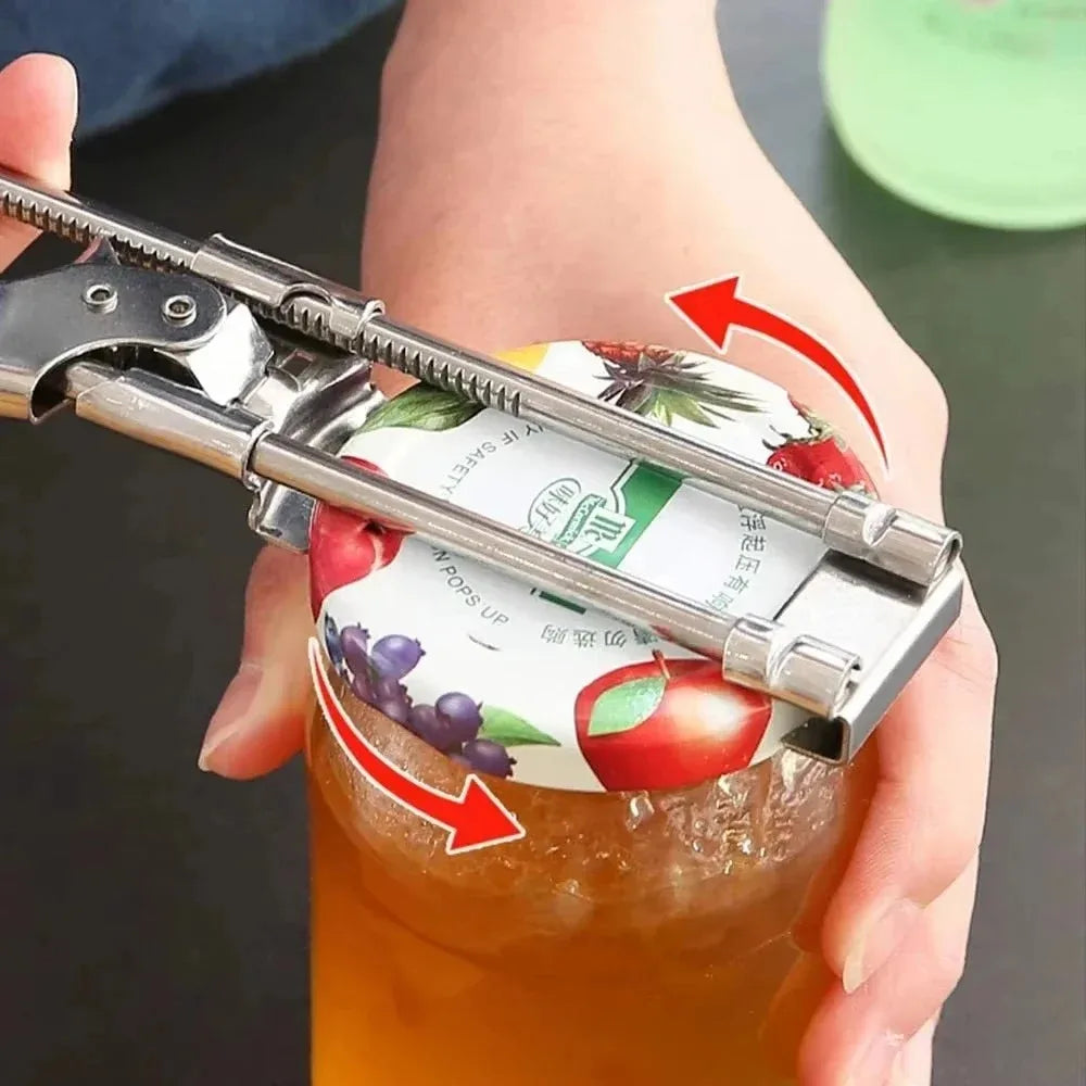 A hand is using an adjustable stainless steel bottle opener to open a glass jar filled with orange juice.