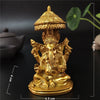 Gold bronze statue of Ganesha Buddha for home decor with a tiered crown and seated posture