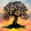 Silhouette of a large tree with roots against a sunset sky.