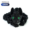 Black articulated Sphynx cat figurine with green eyes, 3D printed desk decor.