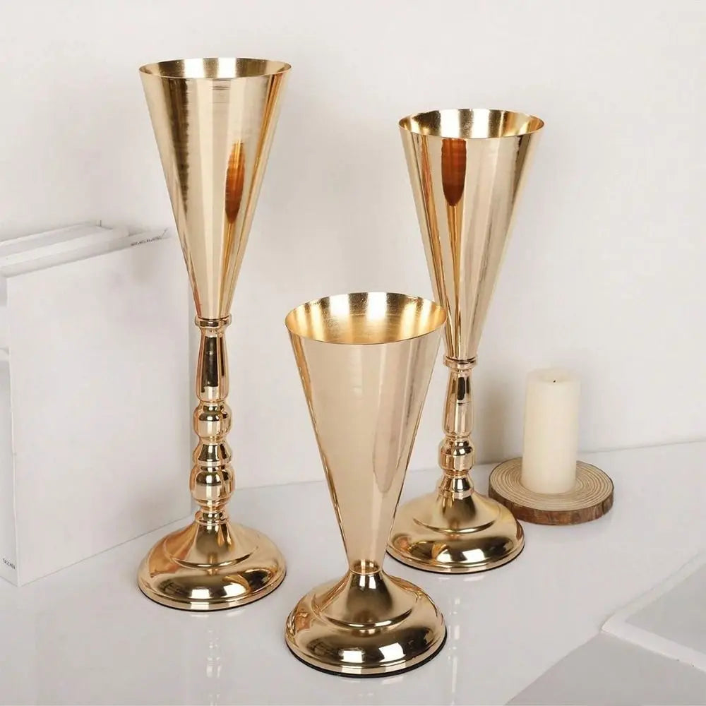 Two elegant golden silver wedding flower vases with tapered forms and decorative bases.