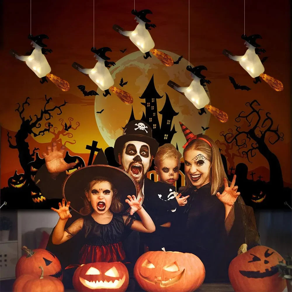A Halloween-themed photo featuring a group of people and floating LED candles with magic wand remote.