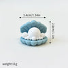 A set of three light blue ocean animal cake toppers, including a whale, octopus, and turtle, displayed on a white background.