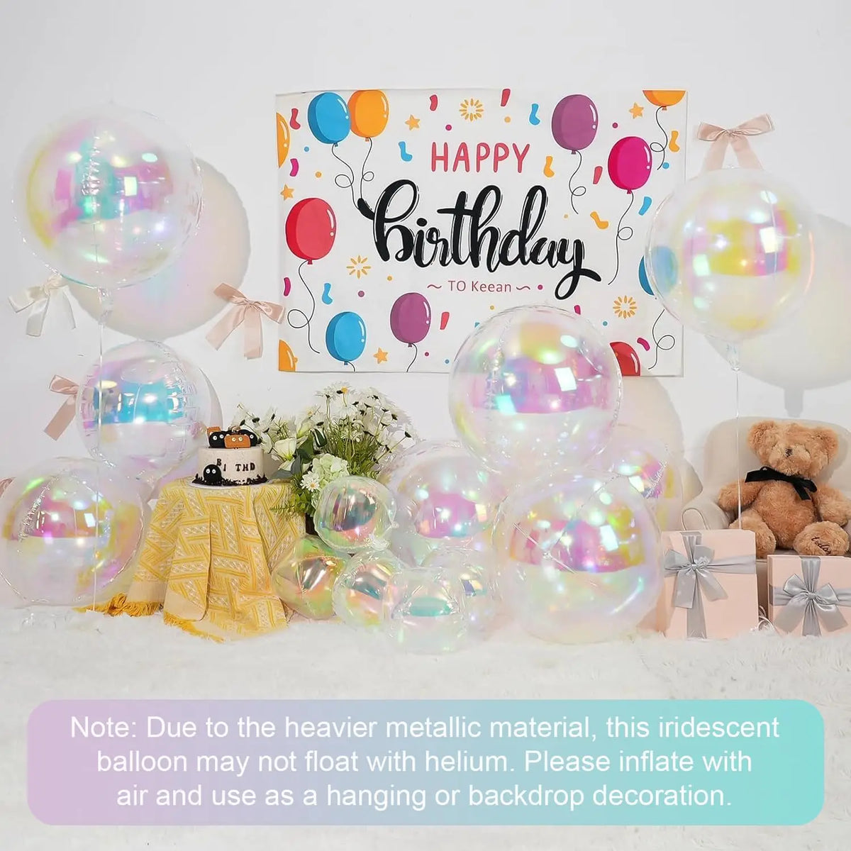 A collection of iridescent holographic round foil balloons in various colors and sizes for party decoration.