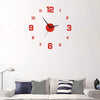 A round red digital wall clock with black hands and numbers mounted on a white wall above a sofa.
