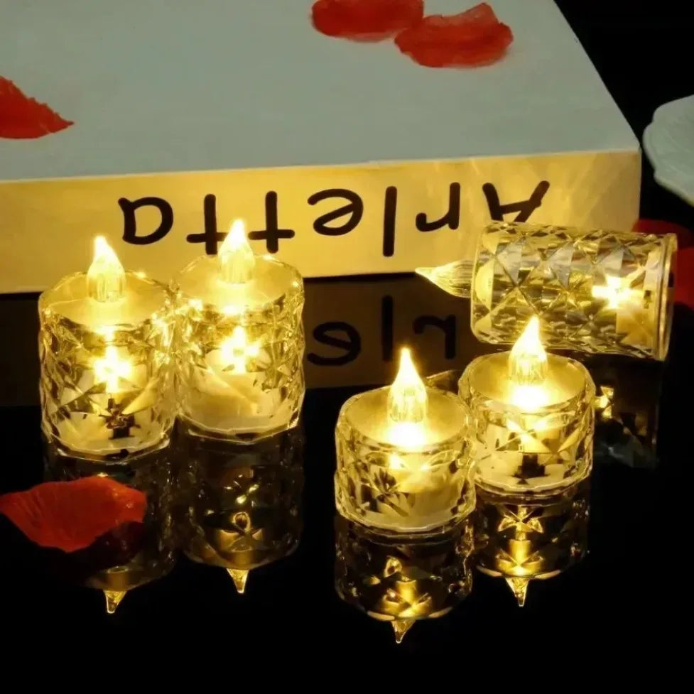 A collection of golden crystal candles with flickering LED lights displayed on a box.