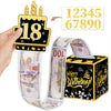 A gold birthday cake topper featuring the number 18 and a ribbon wrapped with US dollar bills.