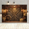 A rustic wooden backdrop featuring a weathered barn door, crossed wooden beams, and hay accents for Western decor.
