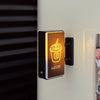 A black magnetic fridge decor featuring a glowing orange outline of a coffee cup and the word COFFEE.