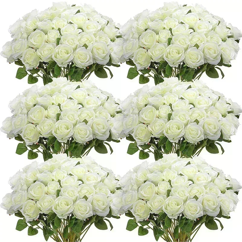 A bouquet of white artificial silk roses, clustered in several arrangements.