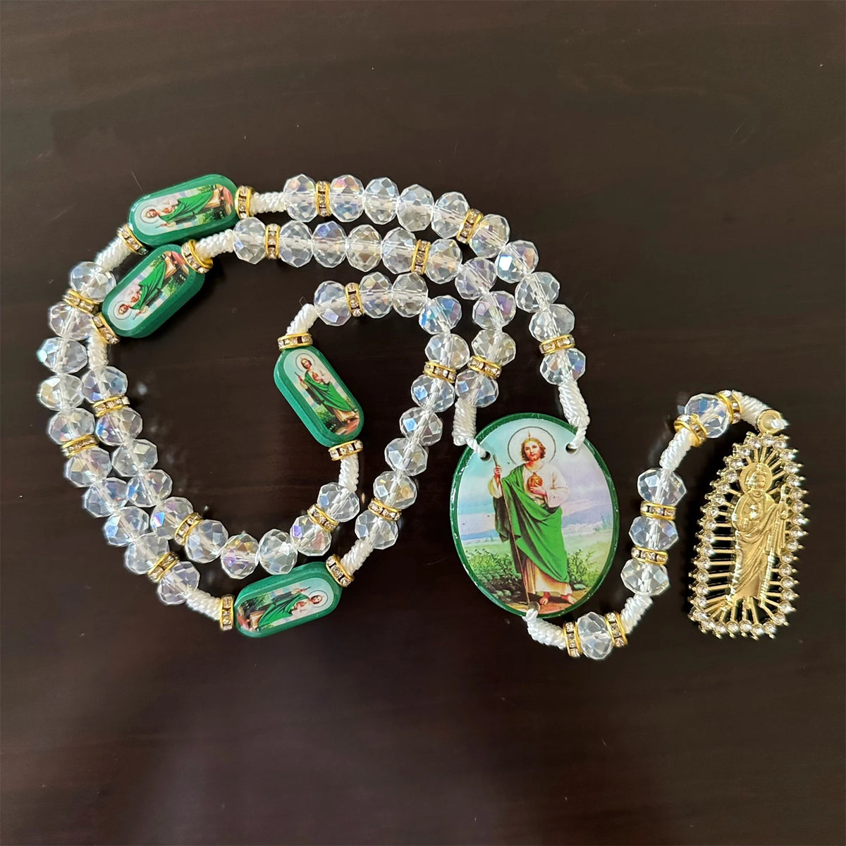 Green crystal rosary necklace featuring Saint Jude and Virgin Mary cross pendants