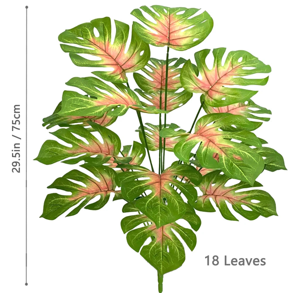 Artificial Monstera plant with silk leaves showing green and pink variegation.
