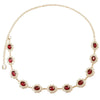 A delicate gold waist chain featuring red crystal accents.