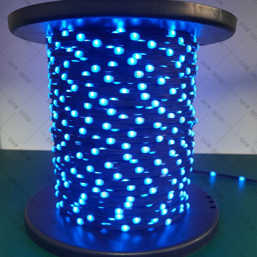 A cylindrical string of bright blue addressable LED lights is displayed on a dark base.
