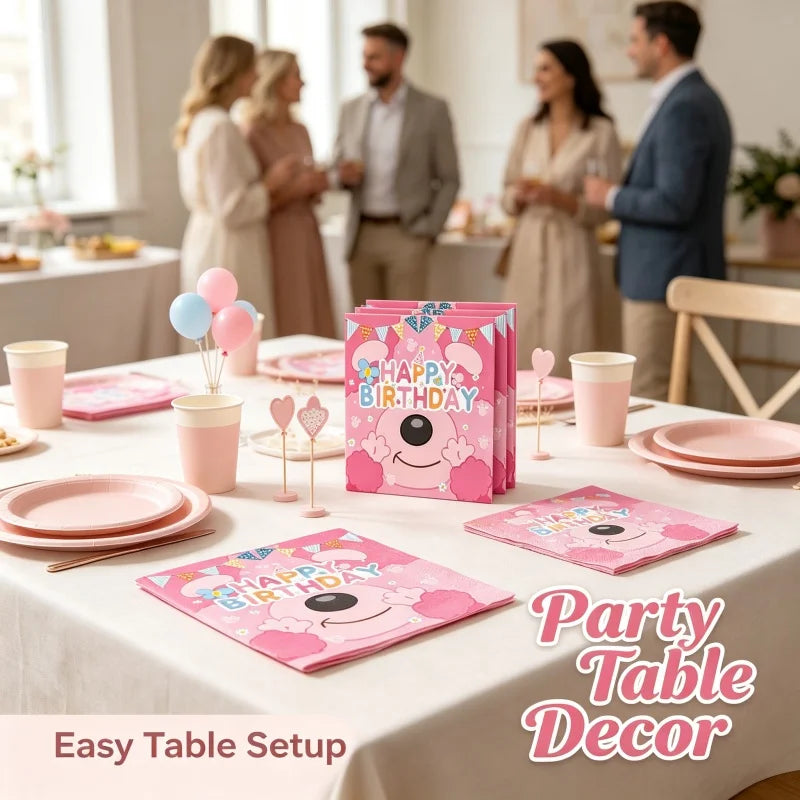 Pink and blue birthday themed disposable tableware set for party decor on a white tablecloth