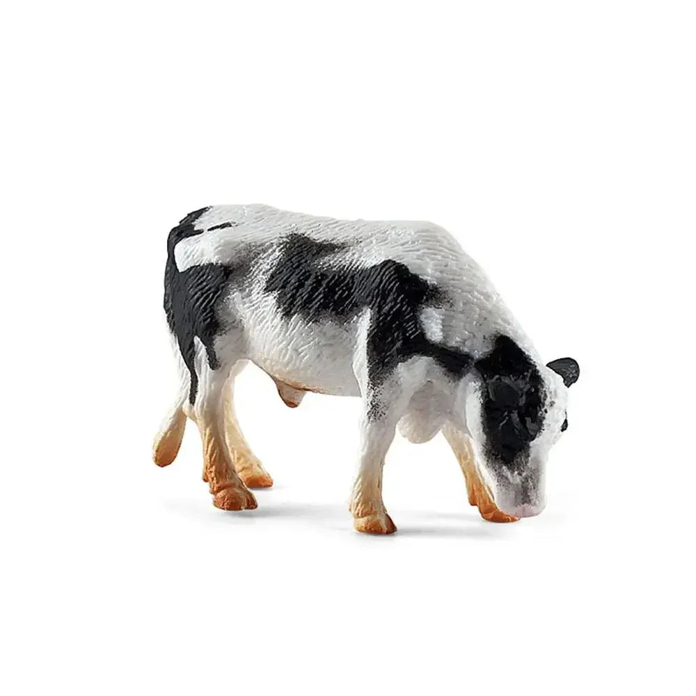 A realistic figurine of a black and white cow.