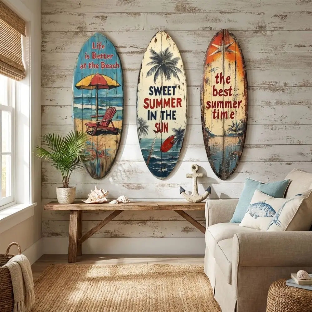 Decorative wooden surfboard wall art featuring tropical scenes and text on a light gray wall.