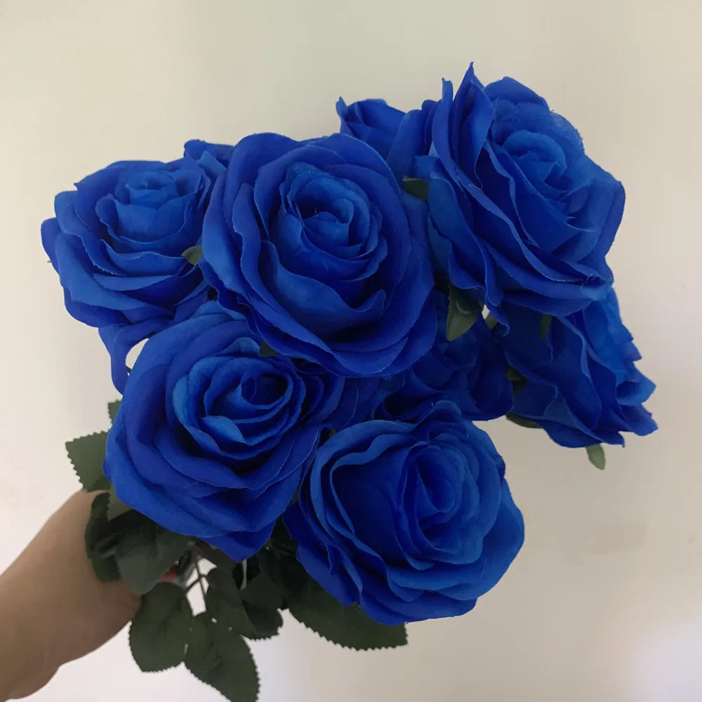 A bouquet of deep blue silk roses used for home and wedding decor.