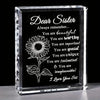 A clear crystal keepsake box with engraved text reading Dear Sister and compliments about her beauty and unique talents.