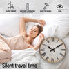 A woman rests in bed with a retro Roman numeral wooden wall clock on the bedside table.