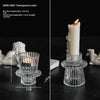 Porta velas de cristal transparente color verde azulado con vela blanca y llama