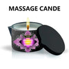 A black jar candle labeled Massage Candle Lavender with a lit wick and a black lid.