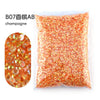 Bag of orange champagne colored resin rhinestones for crafting