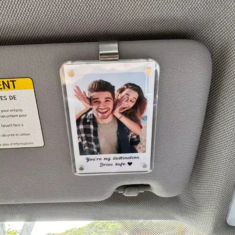 A clear photo clip featuring a couple smiling and the text You're my destination Drive safe.