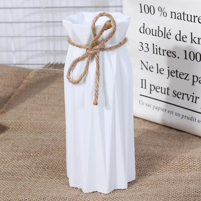 Modern white plastic vase with a basket design tied with twine, standing next to informational text.