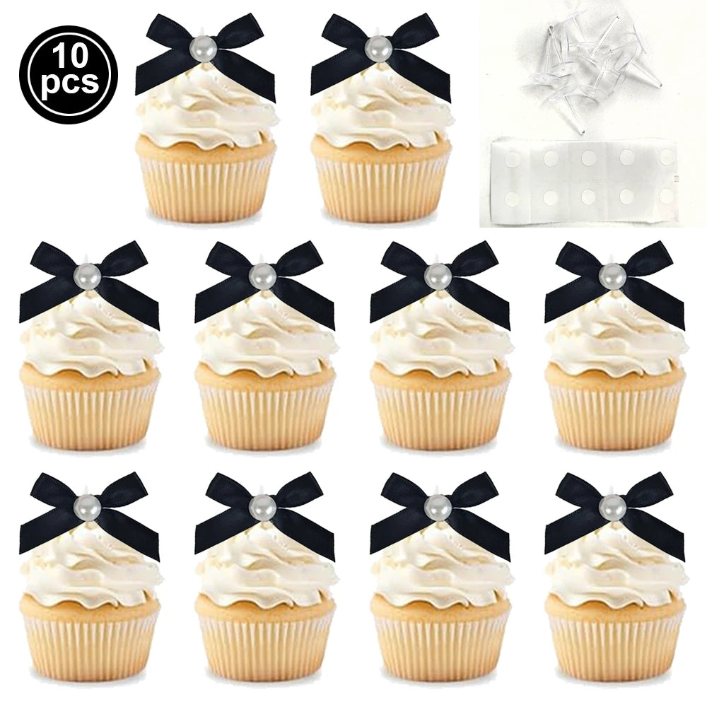 A set of ten pink bow cupcake toppers featuring white frosting and gold accents.