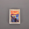 A framed painting featuring a vibrant sunset landscape with a figure in the foreground.