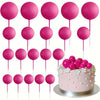 A pack of twenty pink foam ball cake toppers on pink sticks for party decorations