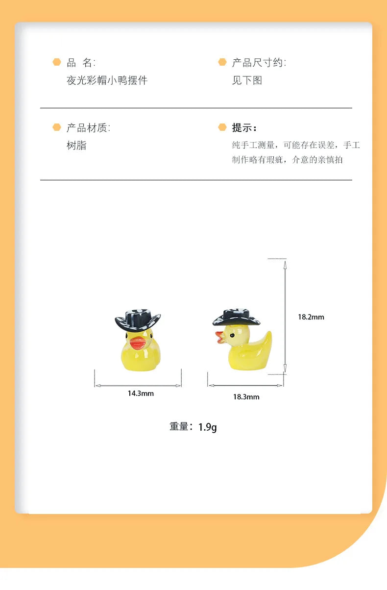 A yellow resin duck figurine with a black hat, shown from the side and top view.