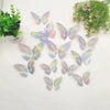 A set of twelve iridescent, holographic butterfly wall stickers scattered on a white background.
